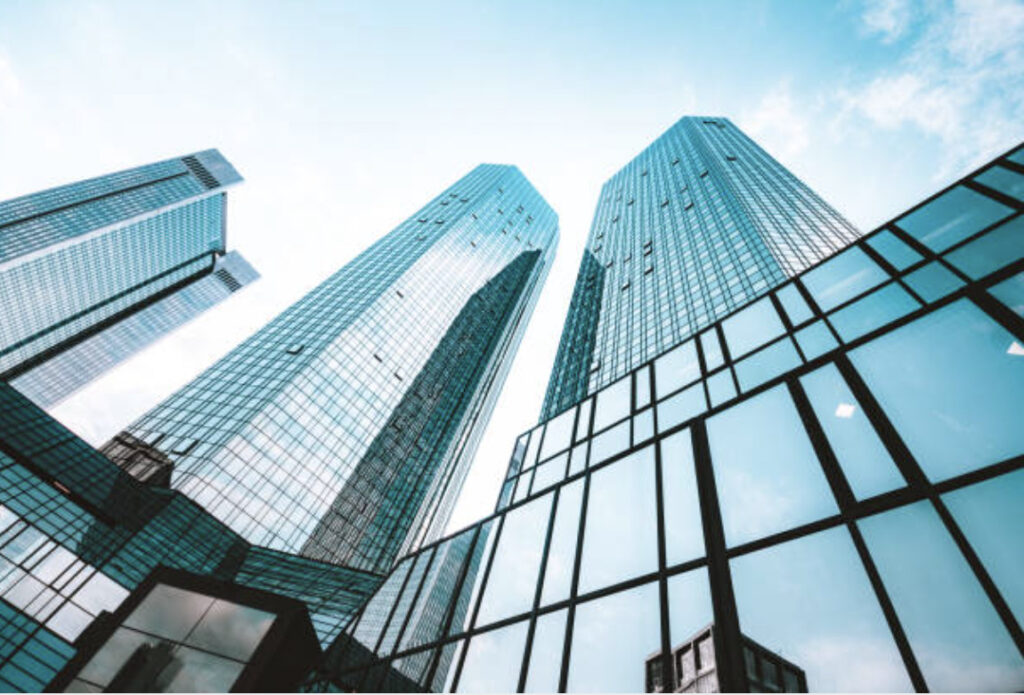 Modern corporate office buildings representing institutional wealth management and business growth strategies by Vitality Wealth Advisors